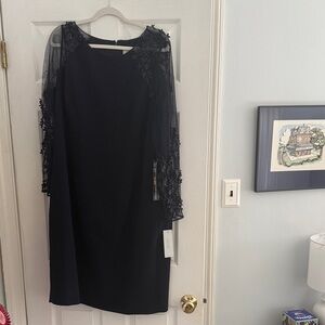 Elegant navy dress with mesh floral appliqué sleeves